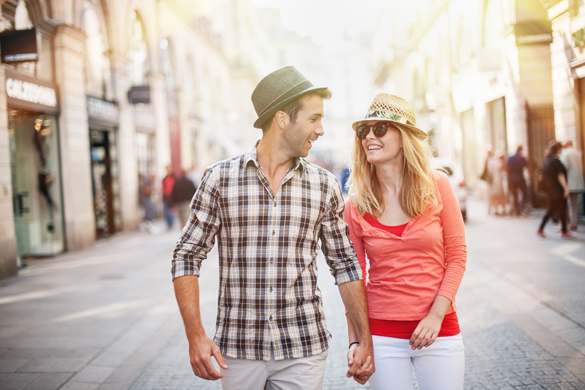 portrait of a beautiful couple walking in the street in summer - Signs A Scorpio Man Likes You