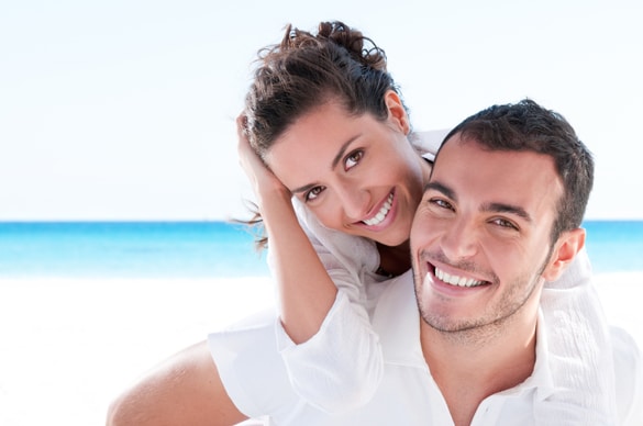 smiling-virgo-man-and-aries-woman-piggyback-at-beautiful-summer-beach